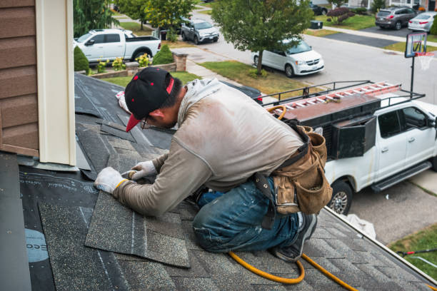 Professional Roofing technician working in Adair, IA